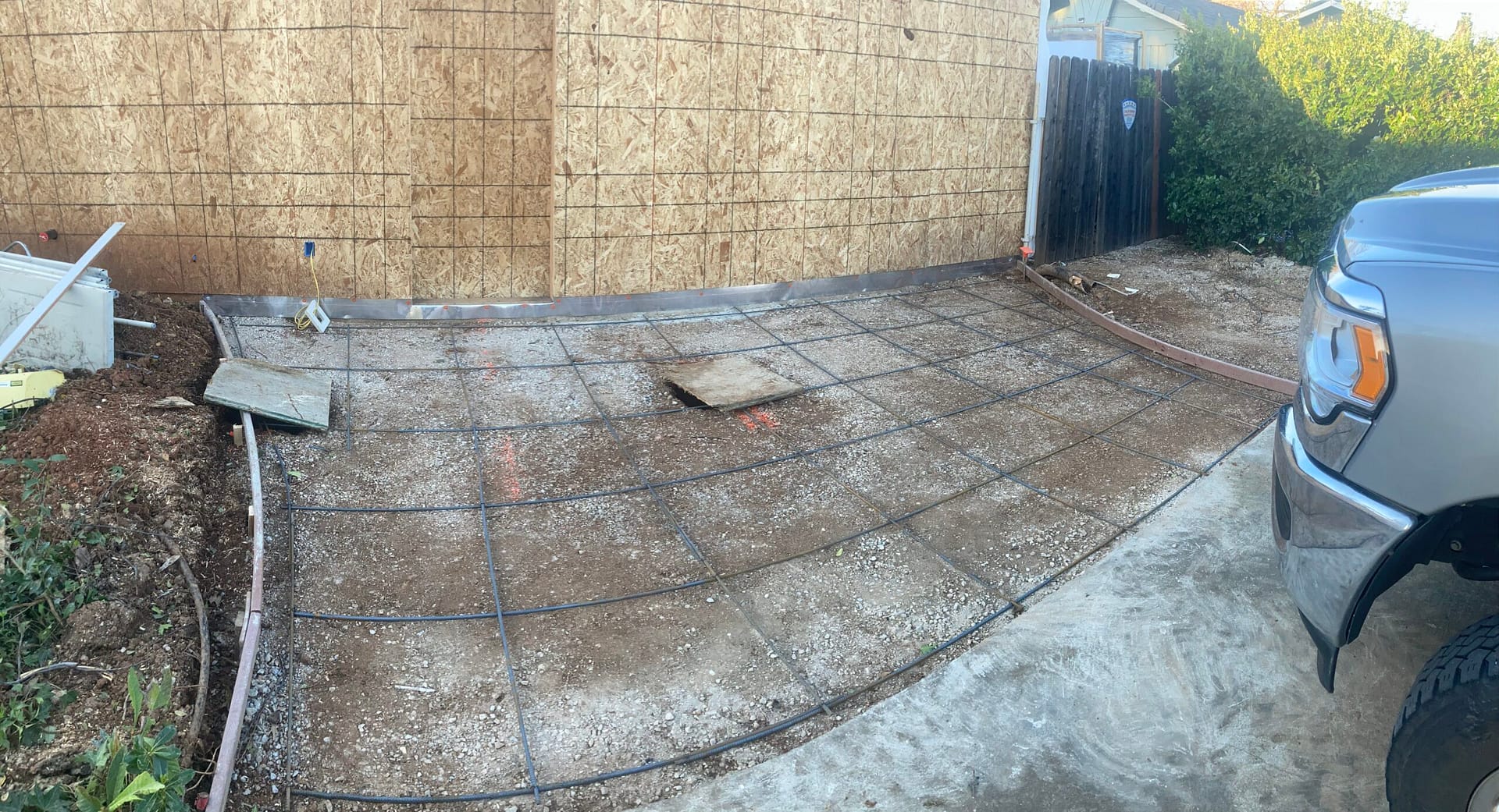 Rebar reinforcement grid and concrete forms prepared for a new residential driveway pour by On Point Construction.