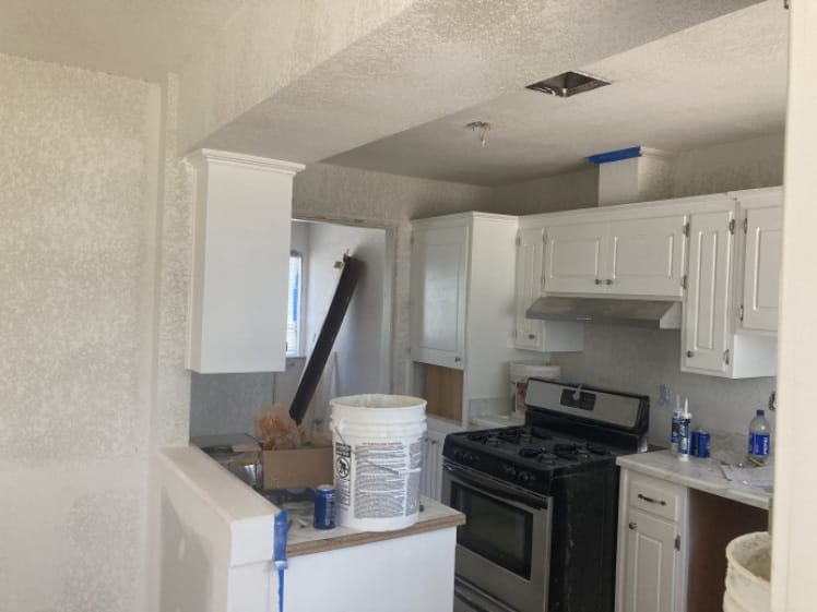 Kitchen remodel in progress with cabinetry installation underway