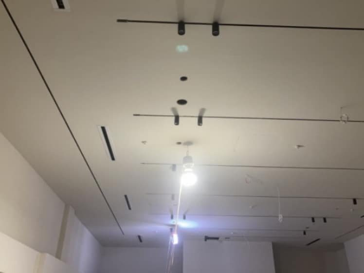 Ceiling lighting installation during retail buildout