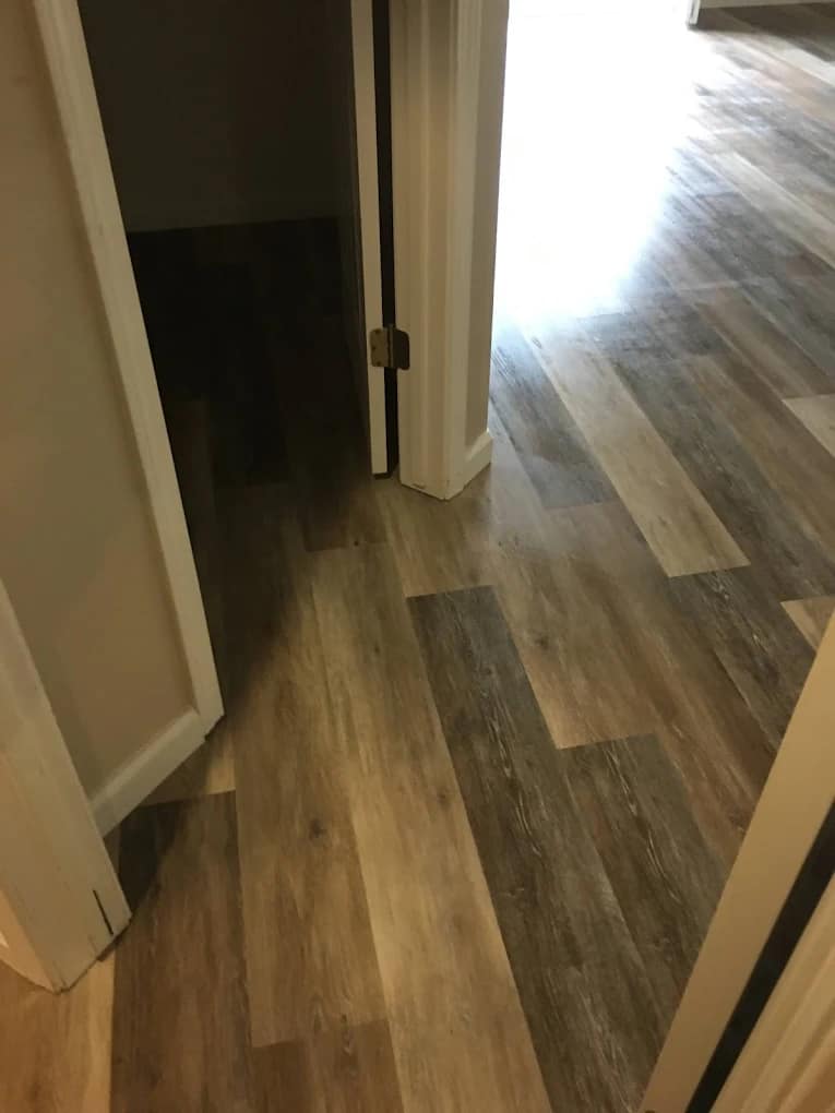 Hard flooring installation with finished trim and clean lines